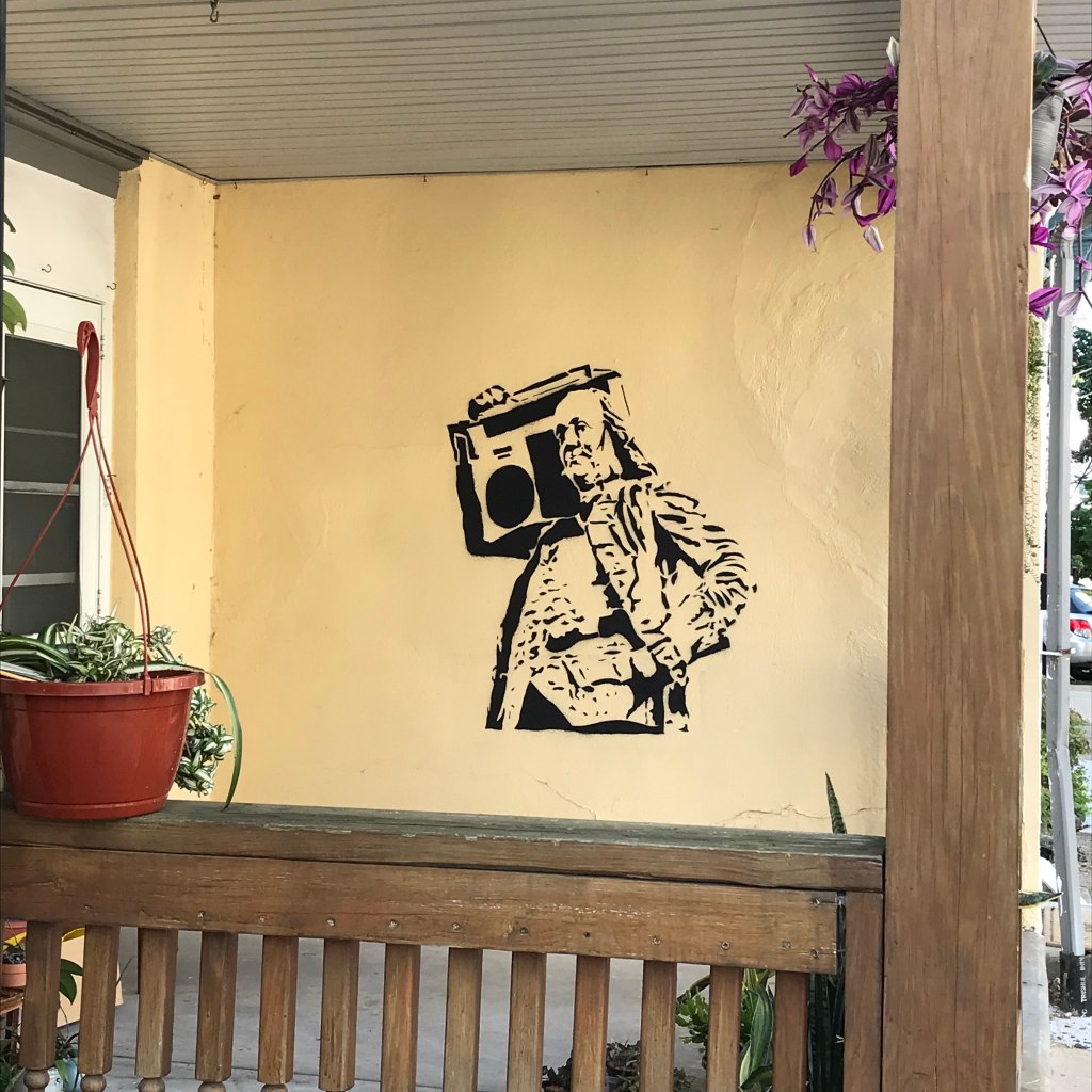 Ben Franklin knows all about publishing hacks. That's why this stencil on someone's house is showing him relaxing to a boombox.
