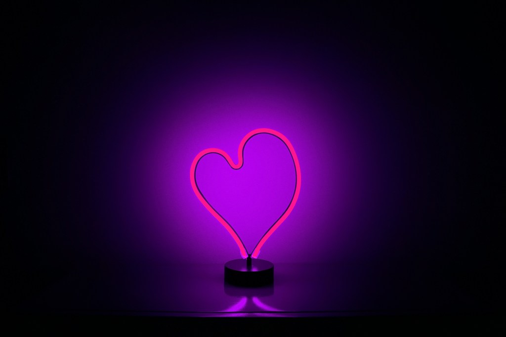 a neon light in the shape of a heart